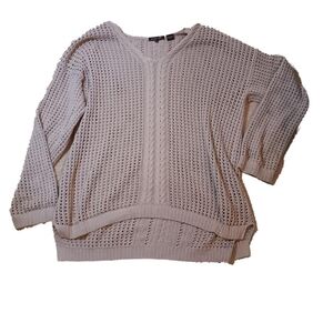 soft tan sweater with a loose fit